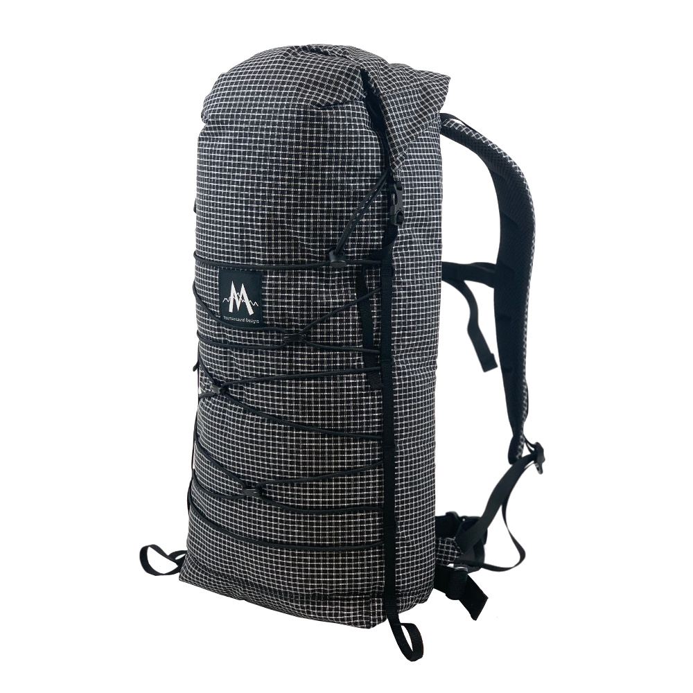A 3/4 side view of the MLD Core pack with black bungee cord.