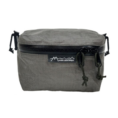 A front view of the MLD Pack Pocket. It is zipped closed.