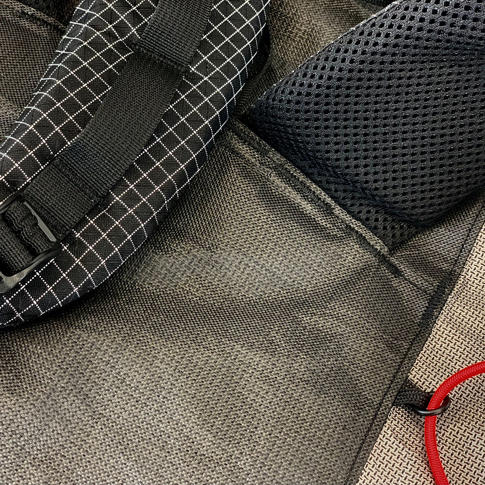 MLD Exodus in Ecopak Ultra Detail showing a part of the back of a shoulder strap and the daisy chain on the front of the other shoulder strap.
