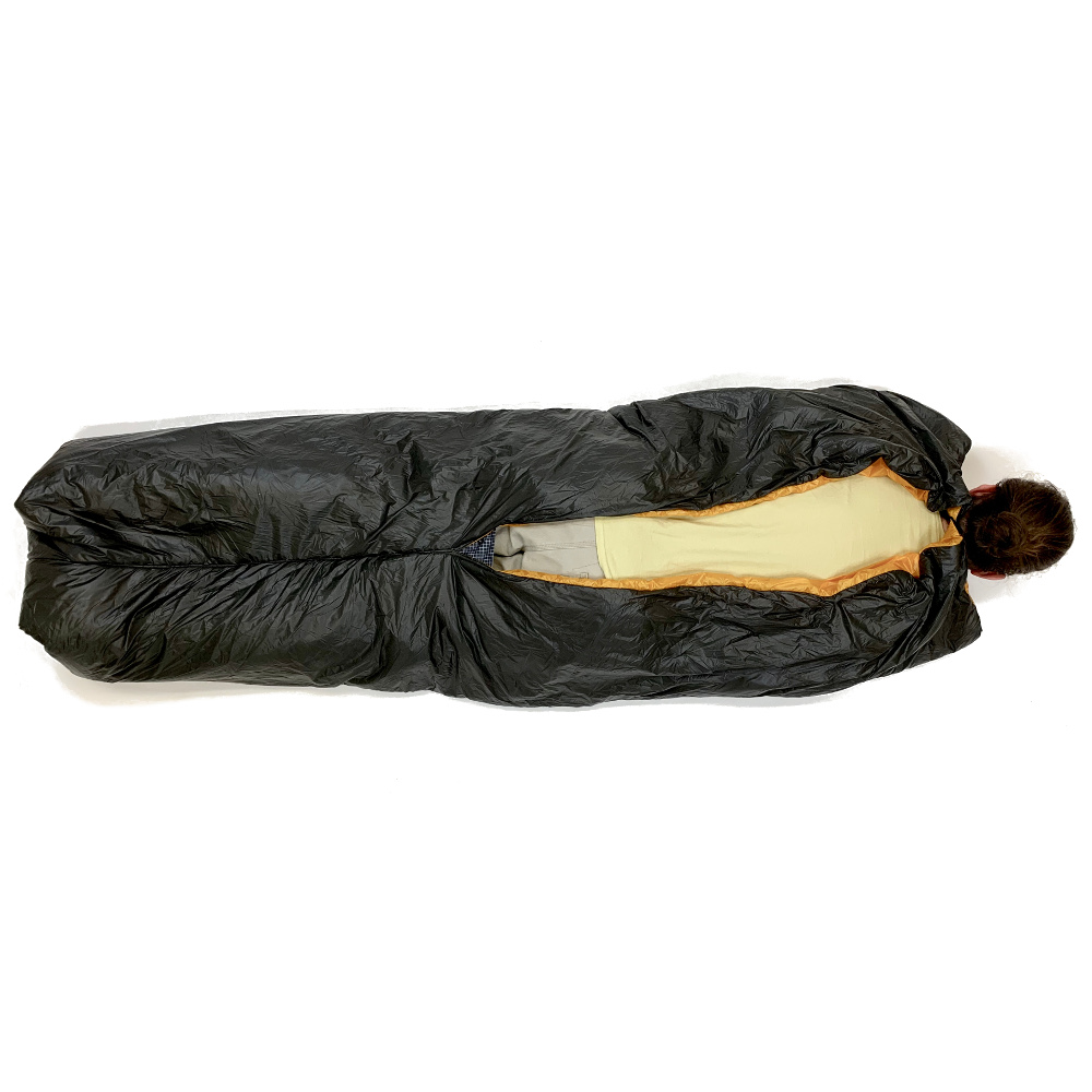 The back view of a Vision Quilt. A man is laying in it, face down.