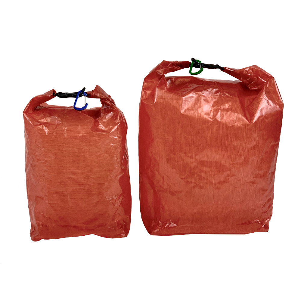 A small (left) and large (right) DCF Food Bag in red.