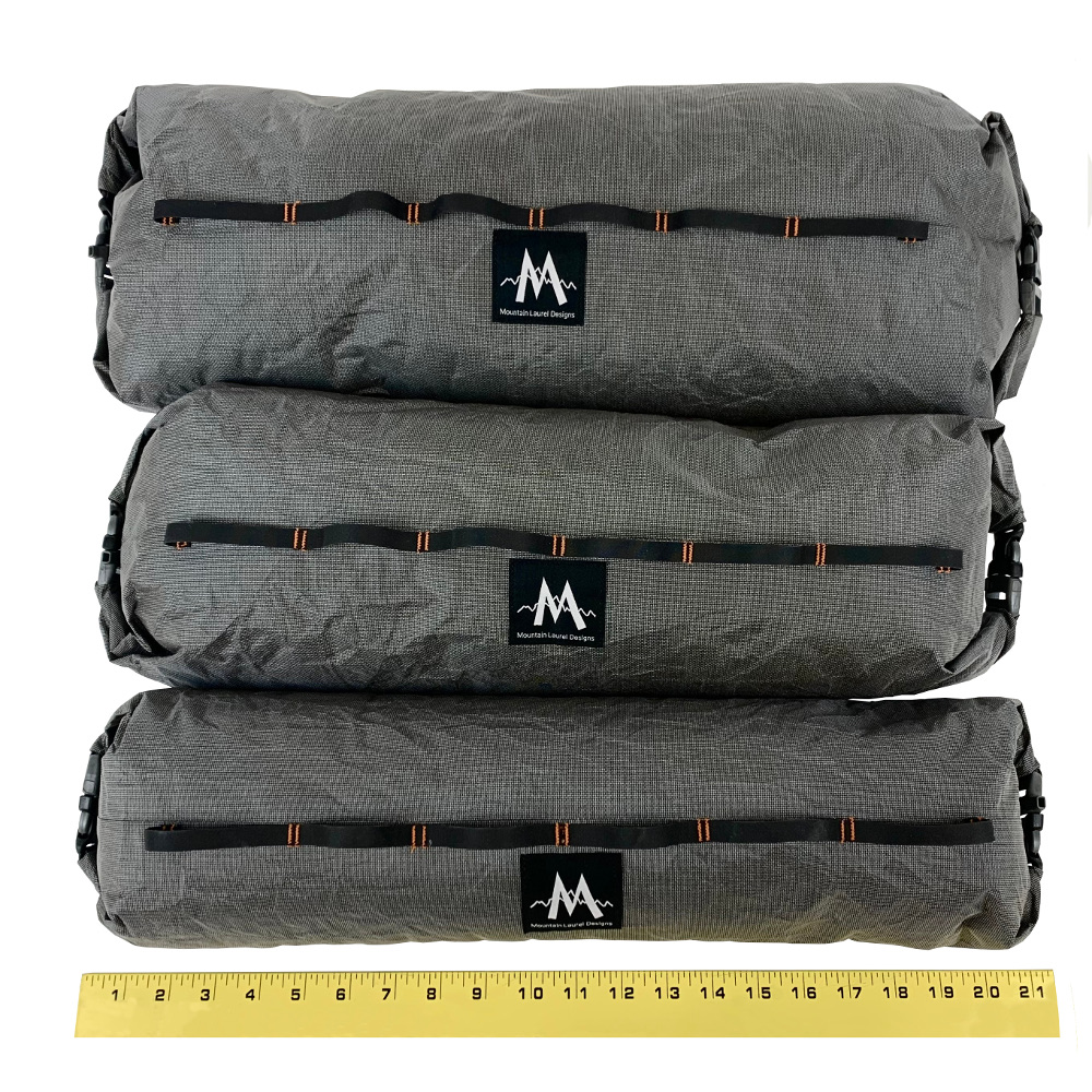 Image shows Ultra X Double End Handlebar Dry Bags stacked on top of each other to show size difference between Small, Medium, and Large. There is a measuring tape showing they are approx. 21" in length