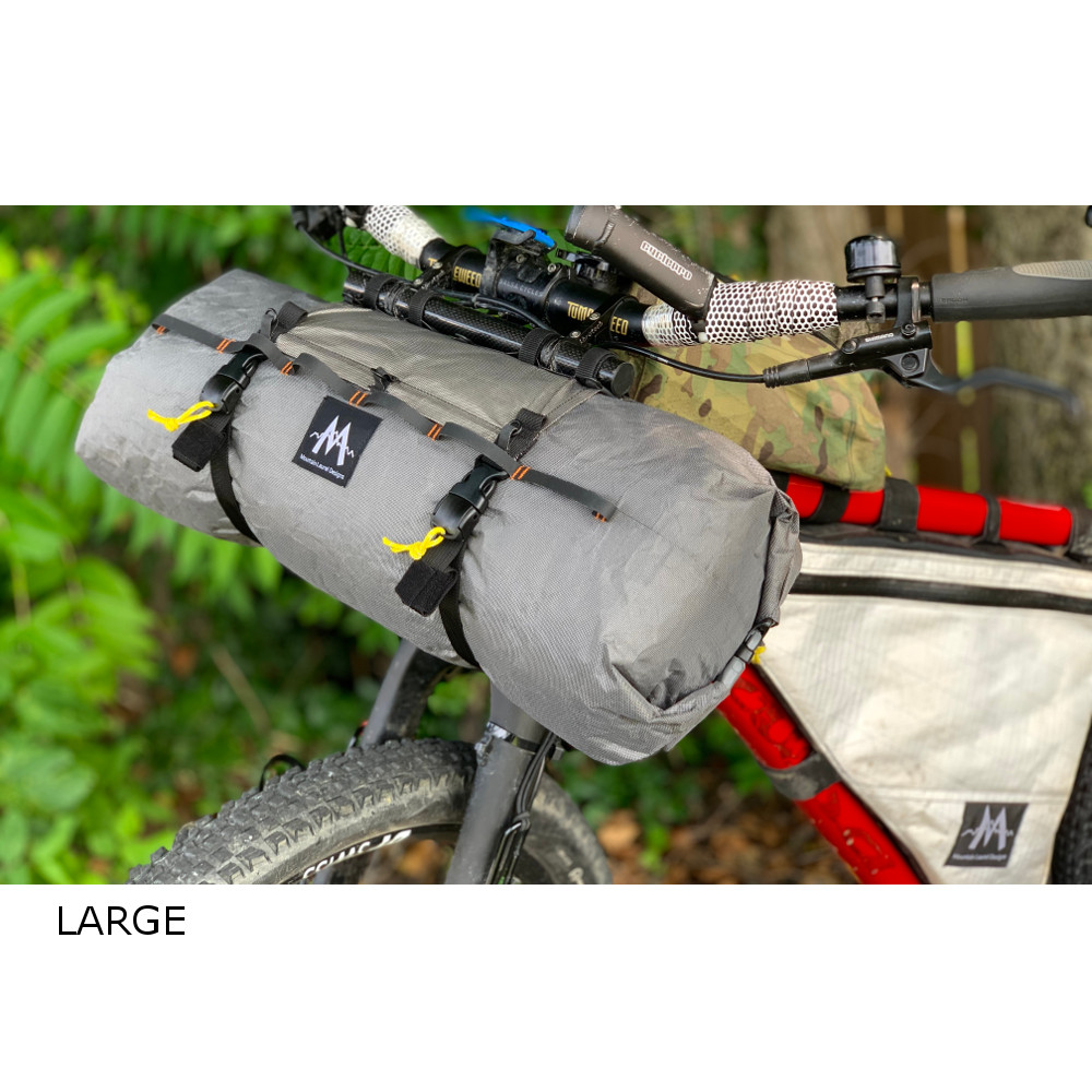 Image shows a Large double-ended dry bag on the handlebars of a bicycle.