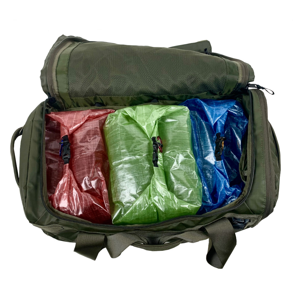 MLD Roll Top Ultralight Packing Cubes fit perfectly in backpacks, carry ons, and other luggage. Three cubes sit side by side in a carry-on.