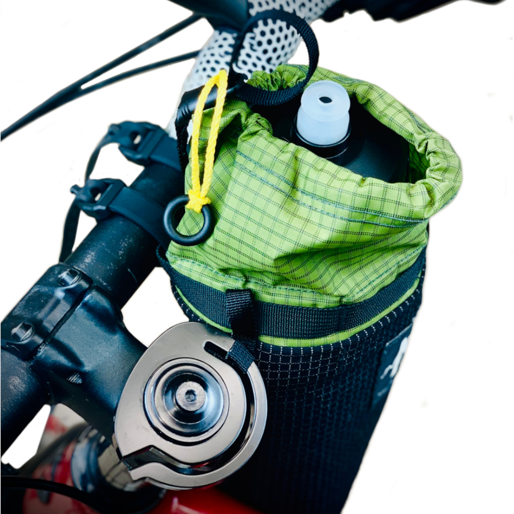 Stem Brulee bag on a bike holding a Water bottle